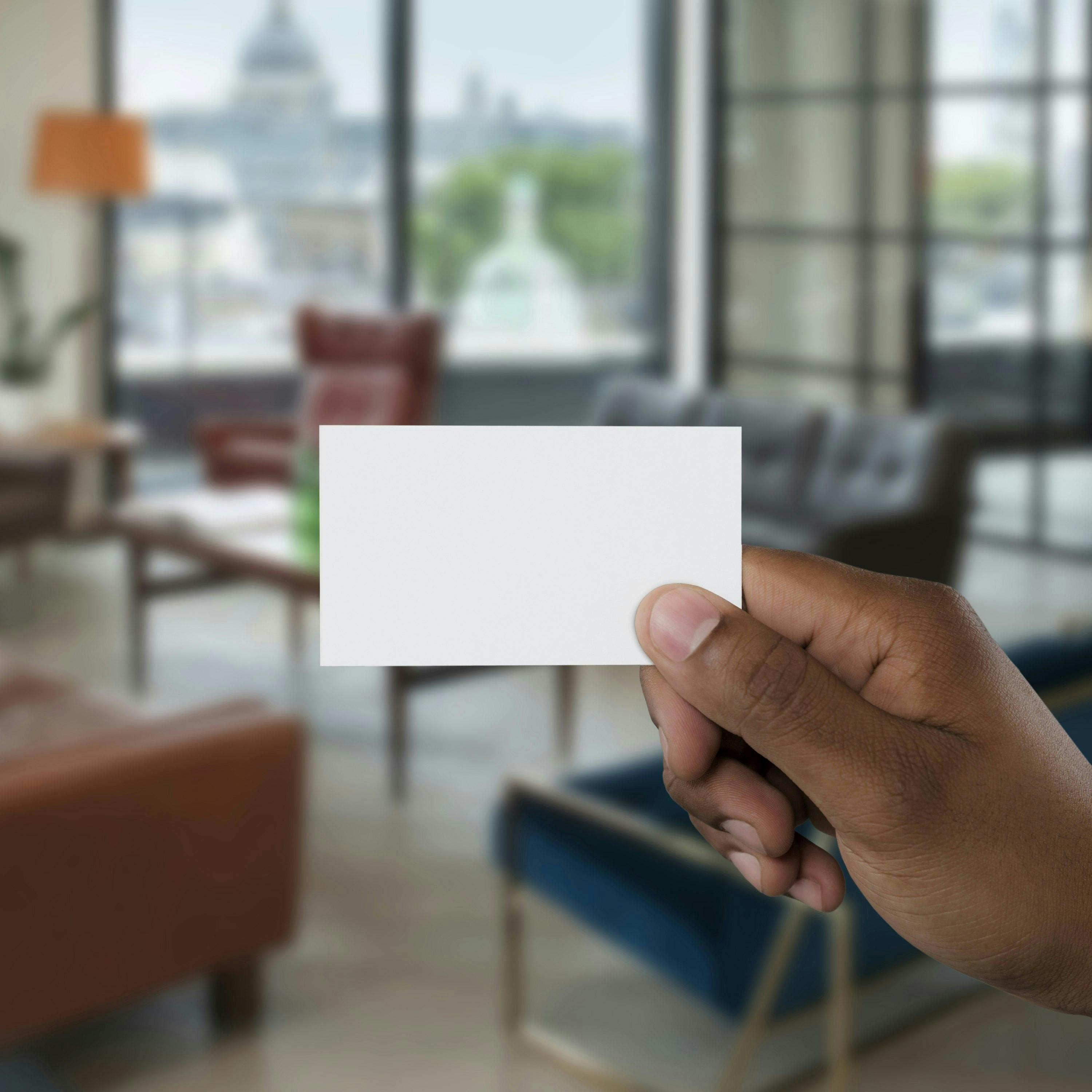 Marketing Image, Man holding blank white business card